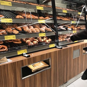 ALDI - a woman standing in front of a bakery counter - Grocery Near Me - Frederick, Maryland