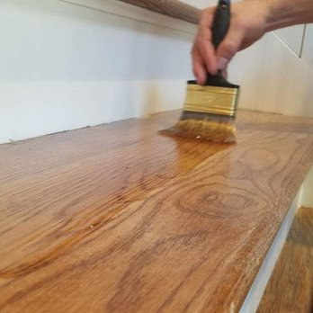 WNC Precision Flooring & Repair - a person using a brush to clean a wood floor - Flooring Near Me - Fletcher, North Carolina WNC Precision Flooring & Repair - a person using a brush to clean a wood floor - Flooring Near Me - Fletcher, North Carolina