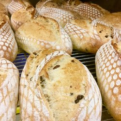 Our flagship Hearthstone sourdough and a Kalamata variation are but 2 of 15+ varieties we offer. Long in process, big in flavour. Try some!