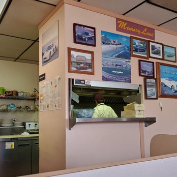 Golden Grill - a woman standing in a kitchen - American Near Me - Redford, Michigan Golden Grill - a woman standing in a kitchen - American Near Me - Redford, Michigan