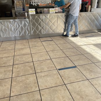 Luci's Chicken -N- Rice - two people standing at a counter - American Near Me - Arlington, Texas Luci's Chicken -N- Rice - two people standing at a counter - American Near Me - Arlington, Texas
