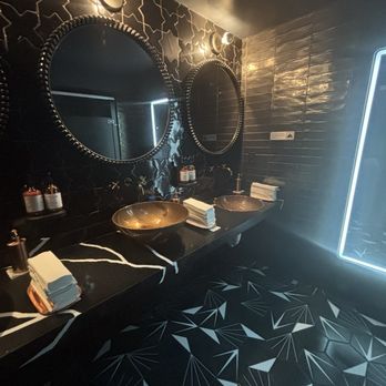 The Continent DC - Gorgeous bathroom with fun lit mirror - African Near Me - Washington, DC, District of Columbia