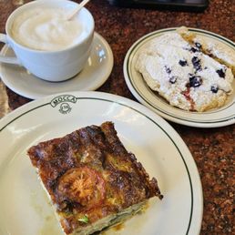 Cappuccino, vegetable quiche, and lemon blueberry scone