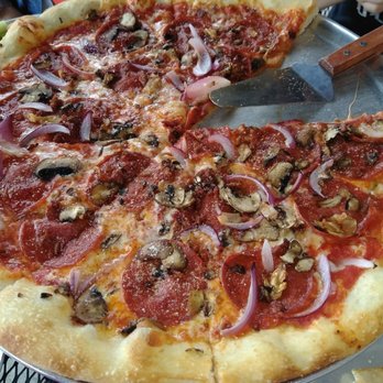 Gallo's Tap Room - Pizza with red onion, mushroom, bacon, pepperoni and roasted garlic. - Sports Bars Near Me - Columbus, Ohio Gallo's Tap Room - Pizza with red onion, mushroom, bacon, pepperoni and roasted garlic. - Sports Bars Near Me - Columbus, Ohio