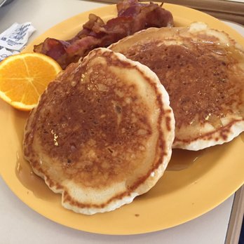 Tee Time Cafe - a plate of pancakes and bacon - Cafes Near Me - Shallotte, North Carolina Tee Time Cafe - a plate of pancakes and bacon - Cafes Near Me - Shallotte, North Carolina