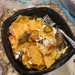 Whole lotta steak nachos? with only 3 pieces of meat and no queso