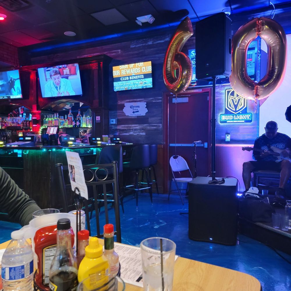 The Beach House - a man sitting at a bar - Sports Bars Near Me - Henderson, Nevada The Beach House - a man sitting at a bar - Sports Bars Near Me - Henderson, Nevada