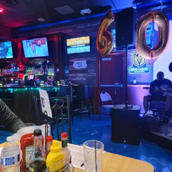 The Beach House - a man sitting at a bar - Sports Bars Near Me - Henderson, Nevada The Beach House - a man sitting at a bar - Sports Bars Near Me - Henderson, Nevada