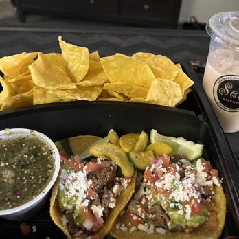 Seis Kitchen - My portion (shared) of green chili pork tacos, calabacitas, chips, salsa and horchata. - Mexican Near Me - Tucson, Arizona