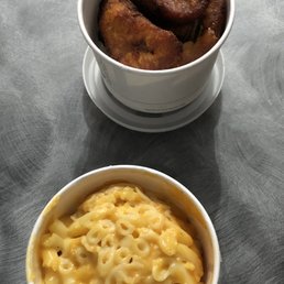 Sides of fried plantains and mac & cheese