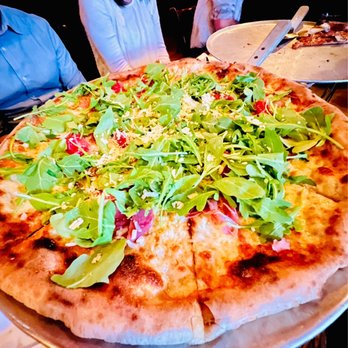 Tre Sorelle - a pizza with greens on it - Italian Near Me - New York, New York Tre Sorelle - a pizza with greens on it - Italian Near Me - New York, New York