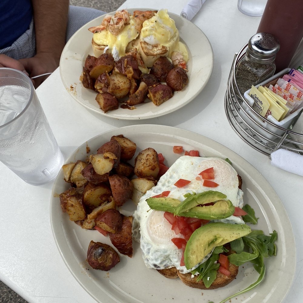 The Cooked Goose - Lobster egg Benedict and egg avocado toast with arugula And and BOMB smoky potatoes. - Breakfast & Brunch Near Me - Westerly, Rhode Island
