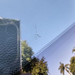 The small chip that was filled and the lines show where the windshield "expanded" . . Thanks a lot, safelite.