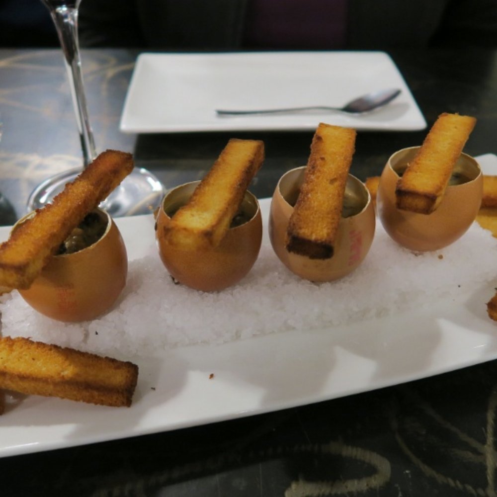 Angelina - Oeufs Façon Coques aux Morilles (eggs and morel mushrooms served in eggshells balanced on a bed of sea salt with toast sticks for dipping) - French Near Me - Cassis, 13 Angelina - Oeufs Façon Coques aux Morilles (eggs and morel mushrooms served in eggshells balanced on a bed of sea salt with toast sticks for dipping) - French Near Me - Cassis, 13