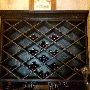 Stone Coat - Who wants to keep their wine near boring walls? We added StoneCoat behind this modest collection to spruce it up a bit. - Masonry/Concrete Near Me - Addison, Texas