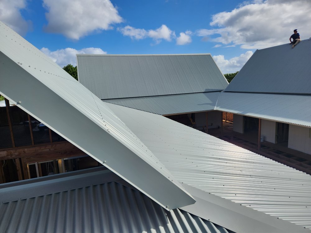 Slide of Metal Roof Pros-Kaua'i Roof Installers