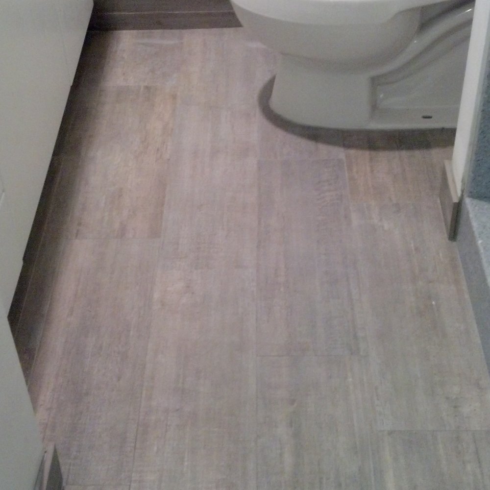 Tile Warehouse - Ceramic tile that looks like wood. I chose the light gray for my guest bath. It also hides dirt & dust really well. - Building Supplies Near Me - Honolulu, Hawaii
