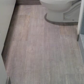 Tile Warehouse - Ceramic tile that looks like wood. I chose the light gray for my guest bath. It also hides dirt & dust really well. - Building Supplies Near Me - Honolulu, Hawaii
