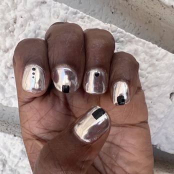 Nail Ria - New manicure with silver chrome polish, square/round shape, and black simple designs, dots and rectangles. - Nail Salons Near Me - Los Angeles, California Nail Ria - New manicure with silver chrome polish, square/round shape, and black simple designs, dots and rectangles. - Nail Salons Near Me - Los Angeles, California