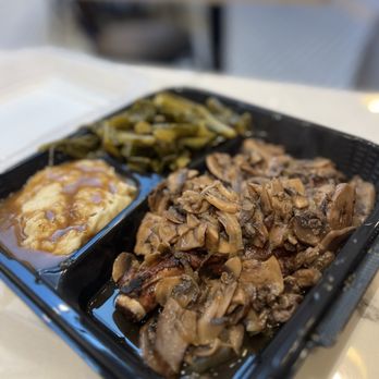 Southern Spin Kitchen - Smothered pork chop with mashed potatoes and collard greens - American Near Me - Dumfries, Virginia
