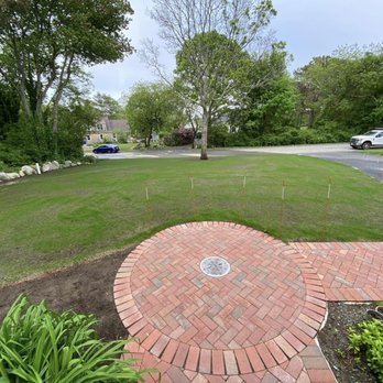 Cape Cod Property Maintenance - a circular brick walkway - Lawn Services Near Me