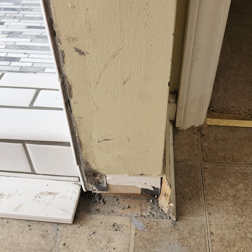Garber Construction - grout on the wall and missing baseboard - General Contractors Near Me - Winston-Salem, North Carolina