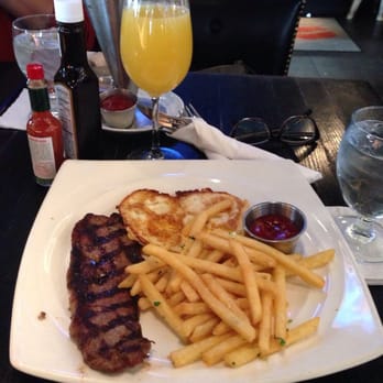 Station 4 - Steak & Egg Brunch with Bottomless Mimosas - New American Near Me - Washington, DC, District of Columbia Station 4 - Steak & Egg Brunch with Bottomless Mimosas - New American Near Me - Washington, DC, District of Columbia