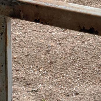 Aaa Lujan Landscaping - a rusted metal fence - Landscaping Near Me