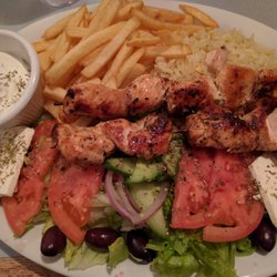 Athena Pizzeria - Chicken souvlaki with fries and salad. The chicken is so tender and the salad is huge. Hope you like cheese!