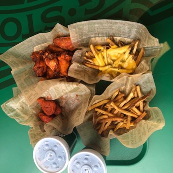 Wingstop - regular fries, cheese fries, original hot bone-in wings, and cajun boneless wings - Chicken Wings Near Me - Santa Clarita, California