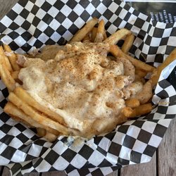 Baja Restaurant - She crab fries... Like a seafood take on poutine.