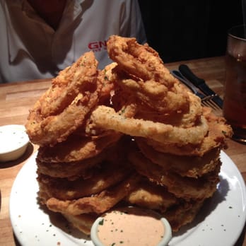Cheddar's Scratch Kitchen - Tower of onion rings served with ranch dressing and a great remoulade sauce. - Comfort Food Near Me - Valdosta, Georgia