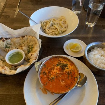 Sunset Bar & Grille - Butter Chicken with Garlic Naan, and Fettuccine Alfredo. - Asian Fusion Near Me - Trinidad, Colorado Sunset Bar & Grille - Butter Chicken with Garlic Naan, and Fettuccine Alfredo. - Asian Fusion Near Me - Trinidad, Colorado