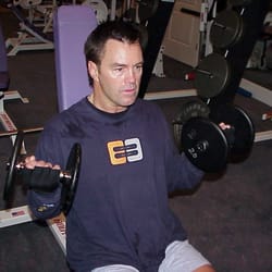 Destiny Management - Dumbbell curls with one of our clients