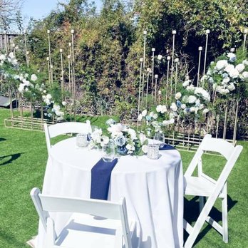 CL Decor - Small decorated table with the candle set which elevated the backyard to feel like a wedding venue - Wedding Planning Near Me CL Decor - Small decorated table with the candle set which elevated the backyard to feel like a wedding venue - Wedding Planning Near Me