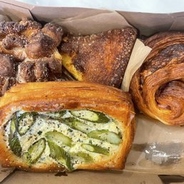 Cardamom bun, almond cake, ham and cheese croissant, asparagus and Gruyère pastry.