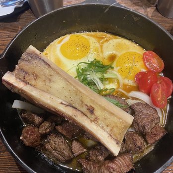 HEM Kitchen And Bar - Bánh mì bò nè with bone marrow (sizzling steak and eggs) - Vietnamese Near Me - Houston, Texas HEM Kitchen And Bar - Bánh mì bò nè with bone marrow (sizzling steak and eggs) - Vietnamese Near Me - Houston, Texas