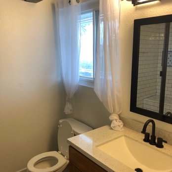 Envision More Renovations - After: new custom vanity, black accents and black tile floor. - General Contractors Near Me - Torrance, California