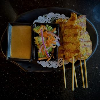 Shandra Thai Cuisine - Chicken Satay (5 Skewers) Marinated Chicken Grilled and served with peanut sauce & cucumber salad. - Chinese Near Me - Palmdale, California Shandra Thai Cuisine - Chicken Satay (5 Skewers) Marinated Chicken Grilled and served with peanut sauce & cucumber salad. - Chinese Near Me - Palmdale, California