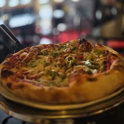 John The Baker - John the Baker pizza: sausage, pepperoni, mushrooms, onions, and green peppers. Add anchovies upon request