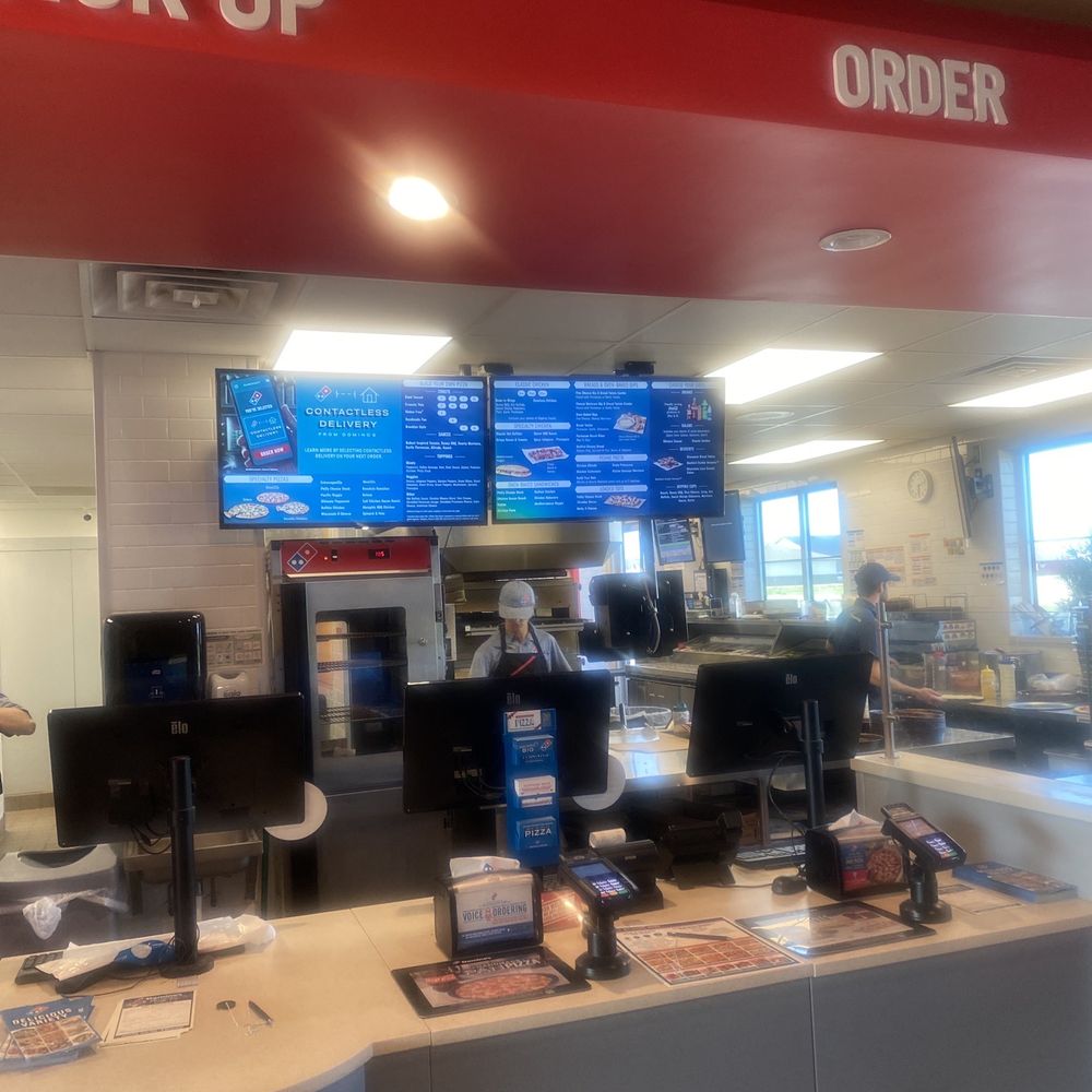 Domino’s - a check - in counter with multiple monitors - Pizza Near Me - Spirit Lake, Iowa