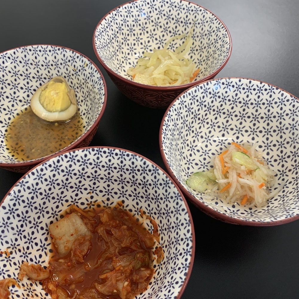 three bowls of food on a table three bowls of food on a table