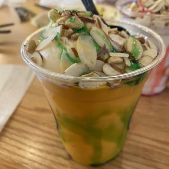 Eggholic - A mango mastani - a mango milkshake with a scoop of ice cream, sliced almonds and green syrup - Indian Near Me - Chantilly, Virginia Eggholic - A mango mastani - a mango milkshake with a scoop of ice cream, sliced almonds and green syrup - Indian Near Me - Chantilly, Virginia