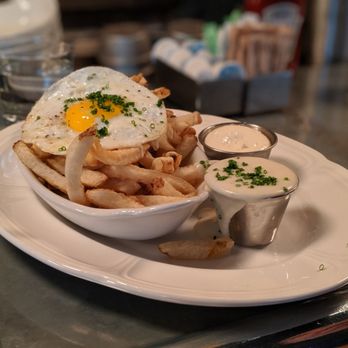 Au Cheval - Fries with mornay sauce, garlic aioli, and fried farm egg - Bars Near Me - Chicago, Illinois Au Cheval - Fries with mornay sauce, garlic aioli, and fried farm egg - Bars Near Me - Chicago, Illinois