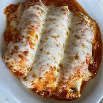 Caffe Positano - Baked Manicotti. - Italian Near Me - Apopka, Florida