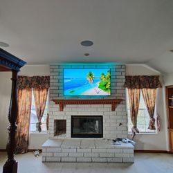 C & E Solutions - 65 inch QLED over fireplace with 7.1 in ceiling and yamaha receiver