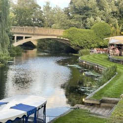 Le Talbooth - The outer edge of the grounds with the river. The bride and groom arrived via the boat from the church