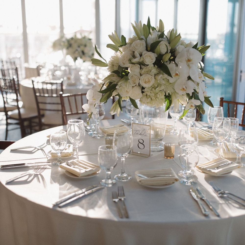 a table set for a wedding reception a table set for a wedding reception