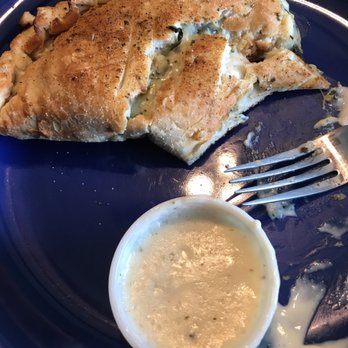 Garbo's Pizzeria - This is the second half of my calzone. It's even better the second day! Chicken spinach artichoke calzone with Alfredo sauce! - Salad Near Me - Springfield, Missouri