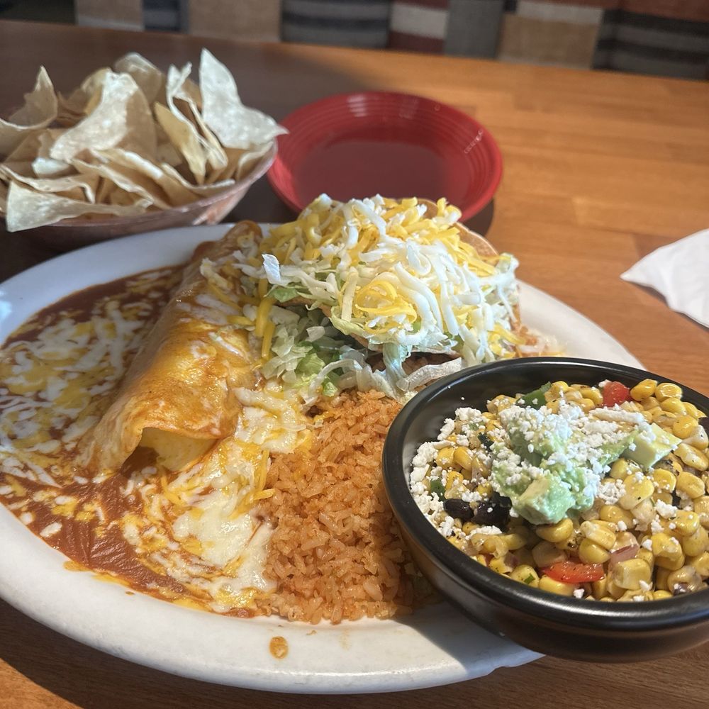 Mi Casa - Chicken enchilada and chicken taco/ corn salad - Mexican Near Me - Costa Mesa, California Mi Casa - Chicken enchilada and chicken taco/ corn salad - Mexican Near Me - Costa Mesa, California